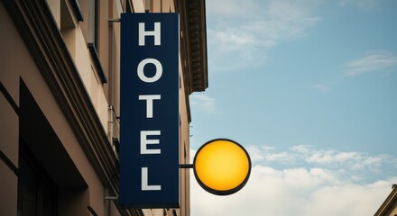 Obraz premium Hotel sign on building exterior against a blue sky