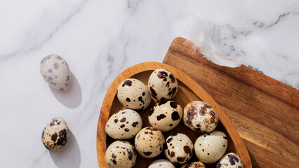 Speckled quail eggs nestle in rustic wooden bowl, celebrating quirky Easter traditions, ancient fertility symbols, culinary alchemy April 5 2025, Barcelona, Spain
