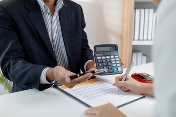 Business negotiation for car purchase shown with toy car models, car keys, calculator, and contract agreement. The images illustrate consultation, signing process, and financial decision.
