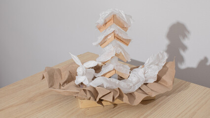 Crinkled paper sculpture resembling a whimsical Arctic fox, evoking Origami Day and quirky eco-art...