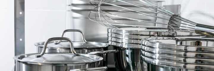 Shiny stainless steel pots and whisks gleam in culinary harmony, evoking kitchen symphony vibes and Kitchenware Day festivity; April 5, 2025, Barcelona, Spain