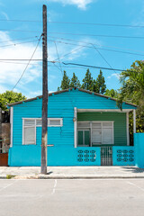 Pedernales, Dominican Republic, 8 august 2025. Typical Dominican Caribbean house made of wood, painted a bright blue color.