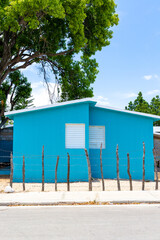 Pedernales, Dominican Republic, 8 august 2025. Typical Dominican Caribbean house made of wood, painted a bright blue color.