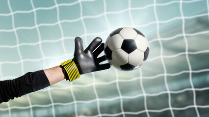 Goalkeeper in black gloves making emotional save of soccer ball in front of net. Concept of defense, resilience, focus, teamwork, advertising visuals and sports branding.