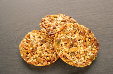Thaler cookies with nuts and honey, on a slate stone, close-up.