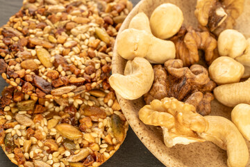 Thaler cookies with nuts and honey, on a slate stone, close-up.