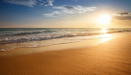 Fototapeta premium Golden Sandy Beach Soft Waves Warm Sunlit Sky