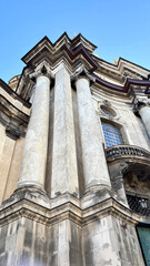 Obraz premium Historic baroque church and cathedral dome in central Lviv, Ukraine. Ancient architecture and religious landmark on Market Square