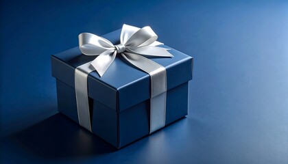 Obraz premium Elegant Blue Gift Box with Silver Ribbon with Festive Present, and Isolated on Blue Background.