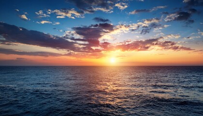 A Beautiful Sunset Over The Ocean With A Few Clouds In The Sky