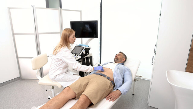 Fototapeta Ultrasonography of abdominal cavity for male patient with ultrasound machine