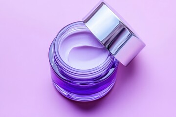 Purple cream in jar with silver lid on pastel background
