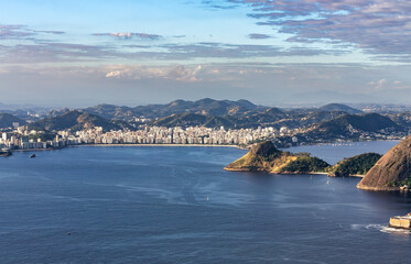 Panoramic view from Pao de Acucar over the vast expanse of Guanabara Bay, with the city of Niteroi...