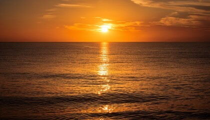 Obraz premium Beautiful Sunset Over Calm Ocean Water Reflecting Golden Light With Warm Hues And Peaceful Atmosphere Du Twilight