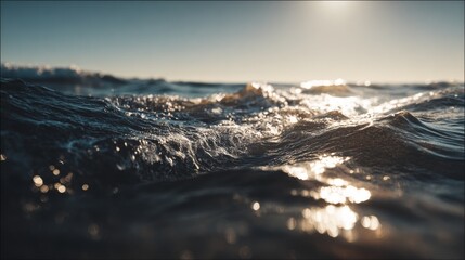 Waves gently lapping at the shore during sunset at a tranquil beach