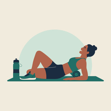 Woman using foam roller for back massage on yoga mat with water bottle exercise