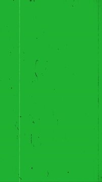 Vintage old film overlay effect with visible scratches, dust particles, and film grain noise on green screen background