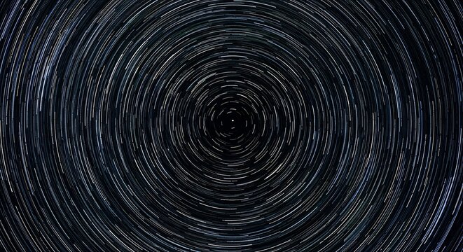 Fil&eacute;s d'&eacute;toiles tourbillonnants captur&eacute;s en longue exposition cr&eacute;ant un motif circulaire cosmique et hypnotisant