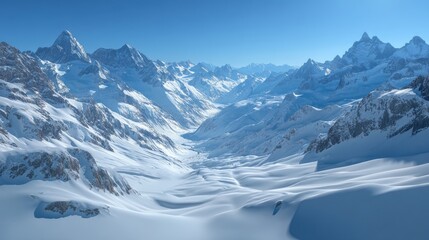 Majestic snowy mountains under serene blue sky expansive vista of a pristine winter landscape and valley