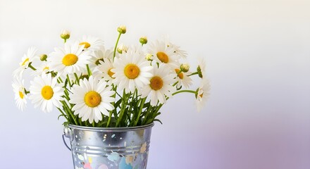 A close-up shot of a bouquet of daisies in a small, decorative metal bucket, with a soft gradient background.