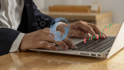 Businessman typing on laptop with digital global stock chart overlay, showing economic data analysis, global finance trends, and market performance in modern office setting