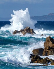 Powerful waves crashing on rocky shore