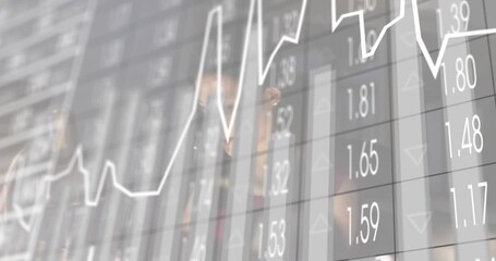 Financial analyst typing on laptop monitoring line graph and bar chart overlay for analyzing trends - Powered by Adobe