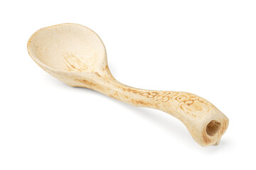 Rustic handmade ceramic spoon with vintage decorative pattern isolated on white background.