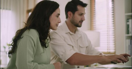 White couple using laptop together at home, focusing on financial planning and teamwork. Cozy modern interior setting with daylight and supportive relationship concept. - Powered by Adobe