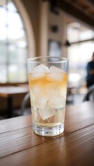 Generative AI refreshing ice-filled beverage on wooden surface.