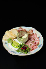 Italian antipasto plate with cold cuts, bread and cheese