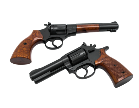 Two revolvers, black metal frames, wood grips and barrel, on a black background