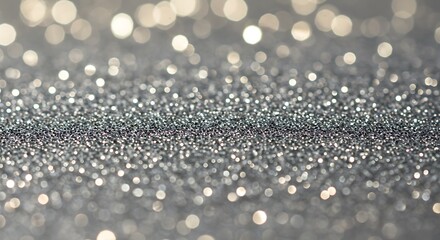 Sparkling silver glitter background with blurred bokeh effect close up