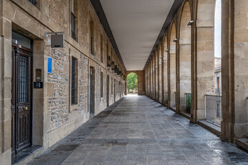 Historic Stone Arcade with Columns and Arches, Covered Walkway, Urban Architecture, Perspective View, Traditional Building, City Street, Archway