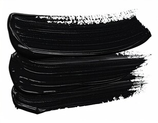 Two strokes of glossy black paint on white background, showing textured edges