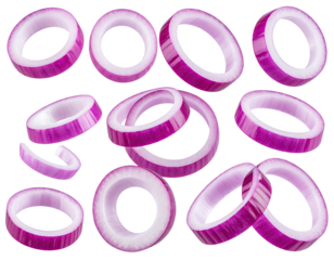 Overhead view of sliced red onions, some overlapping, against a stark black