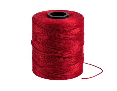 A close-up of a cylindrical spool of vibrant red thread against black background
