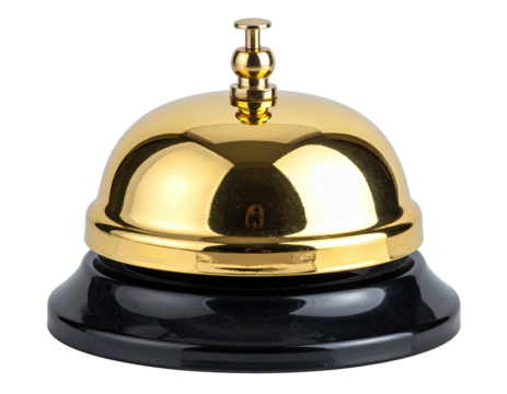 Shiny gold desk bell with a black base. Isolated on white