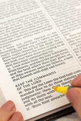 Commandments of the LORD text in open holy bible book. Christian wisdom, obedience and faith in God Jesus Christ, biblical concept.