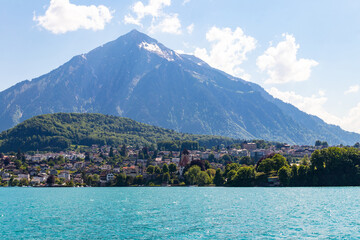 View of the Lake Thun and Niesen mountain (so called Swiss Pyramid) in Switzerland