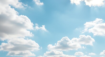 Fototapeta premium Bright blue sky with fluffy white clouds and sunlight background