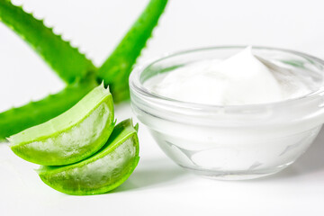 aloe vera - leaves and cream isolated on white background