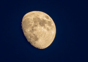 Aerial view of the moon's serene glow, the cratered surface in stark relief against the inky expanse, a celestial dance of light and shadow, Space.