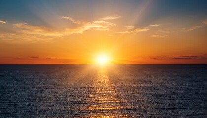 Obraz premium Beautiful Orange Sunset With Sun Rays Blue Ocean Water Calm Weather Sunny Day