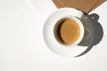 Aromatic Espresso Coffee on Desk with Papers. Coffee Break at Work.   