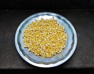 Fresh Yellow and White Corn Kernels on a Metal Plate
