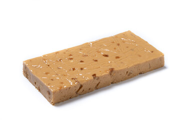 Soft almond nougat bar isolated on white background