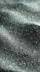 Close-up of grey sand texture with a raw, gritty, grunge appearance. Abstract natural background useful for design, photography overlays, or creative minimal backdrops with an earthy tone.