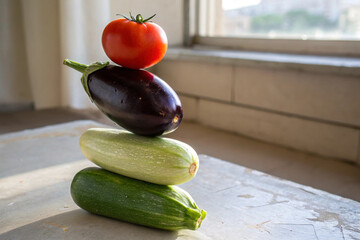 Stacked Fresh Vegetables like tomato, eggplant, cucumber, squash