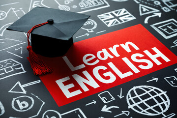 the phrase “Learn English” on a red background, next to a graduation cap and drawings symbolizing education and knowledge